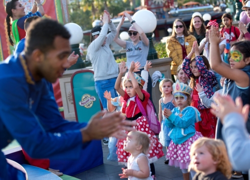 Blue13 dancers entertain young audience members at Disneyland