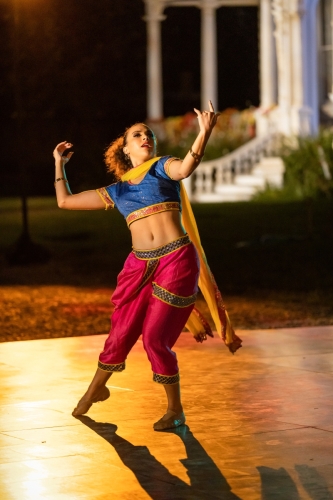 Blue13 dancer performing in traditional Indian dress at Heritage Square Museum