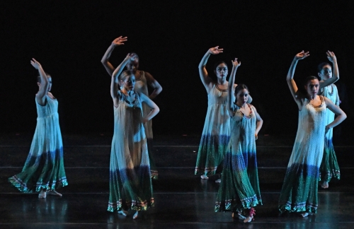Blue13 dancers performing in floor length flowing gowns