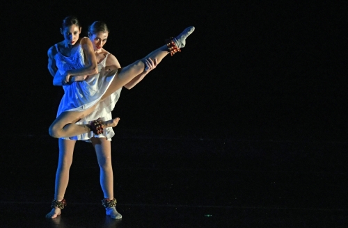 Two Blue13 dancers performing on stage